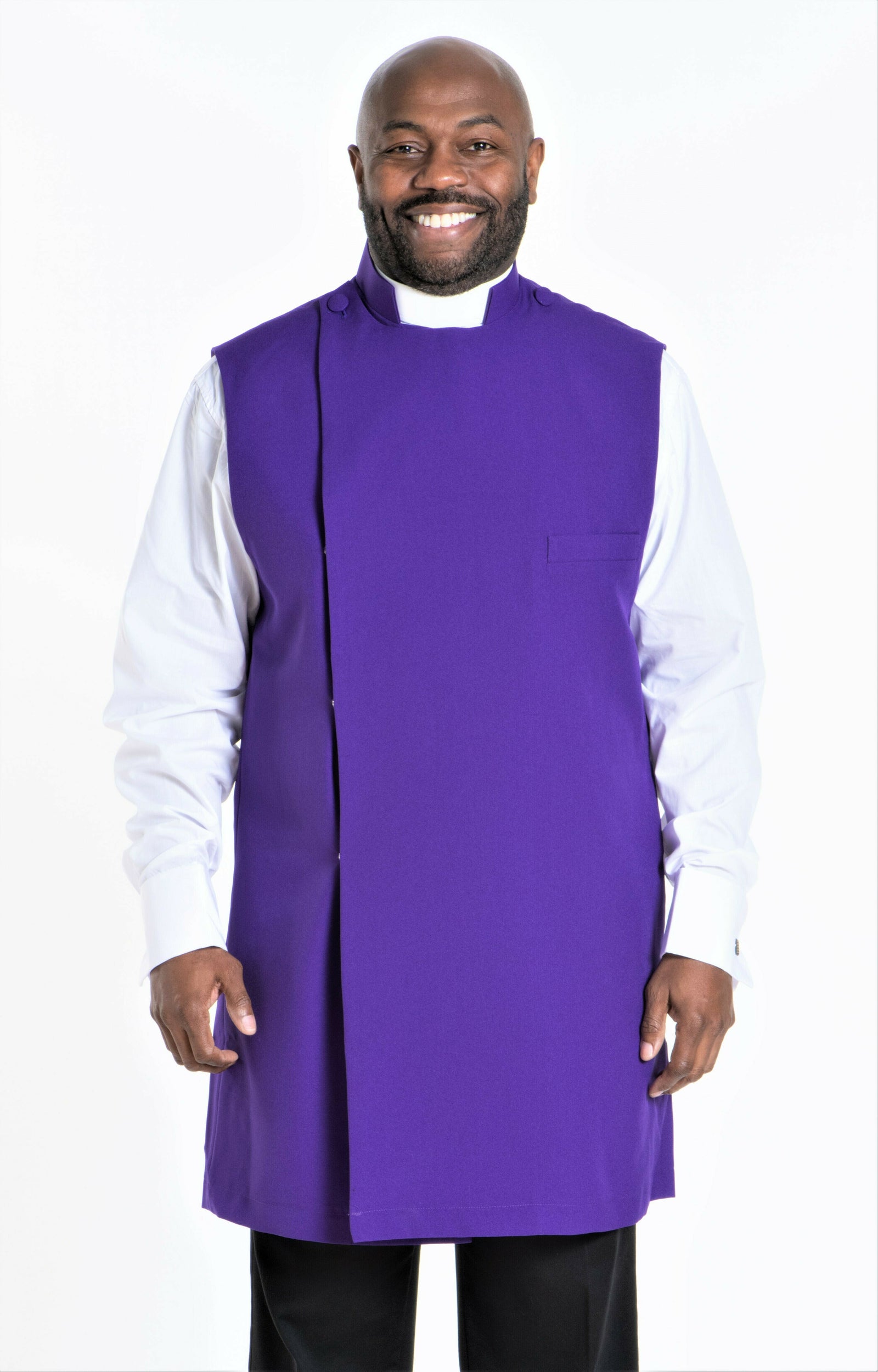 Clergy Apparel and Accessories featuring a smiling man in a purple clergy robe with a white shirt underneath.