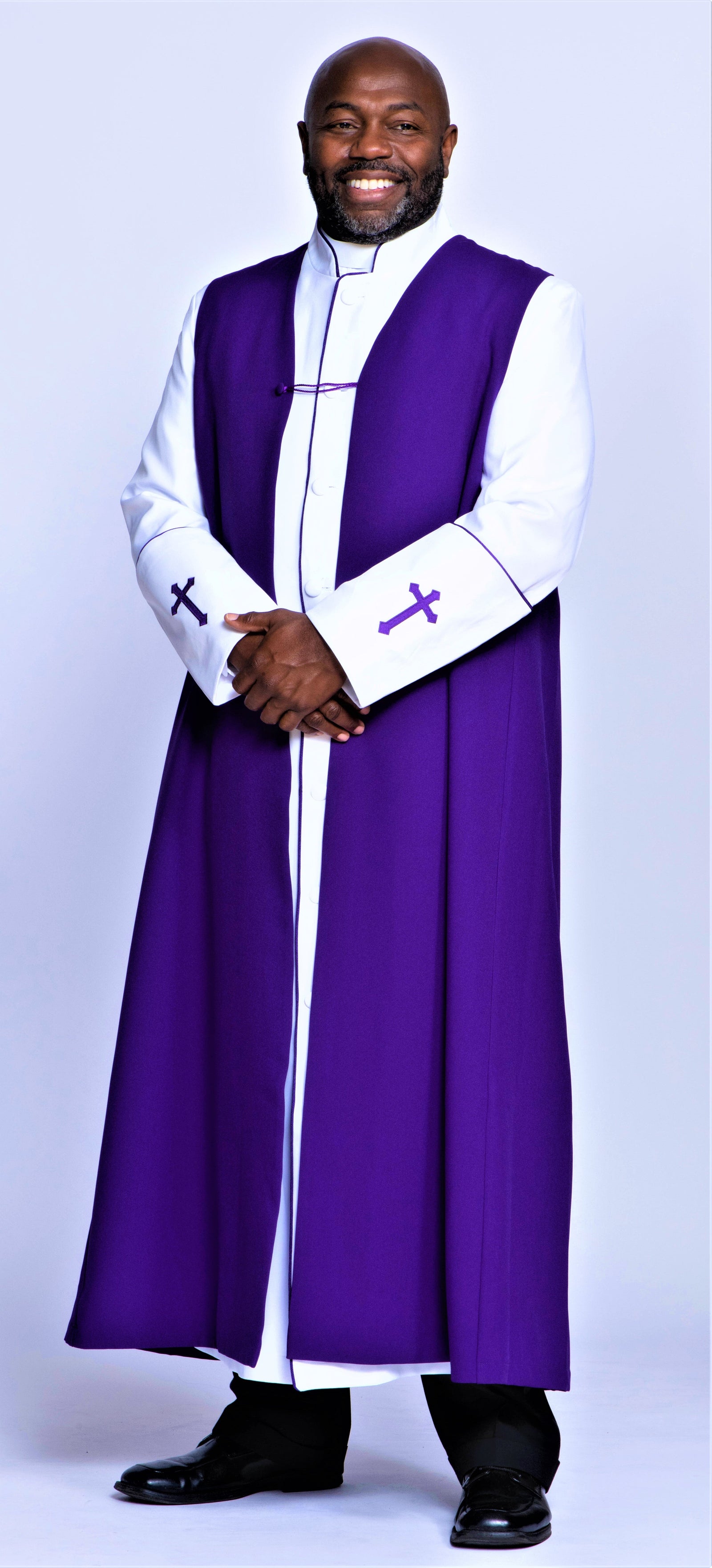 Men's Chimere worn by a smiling man, featuring elegant purple fabric and traditional clergy design.