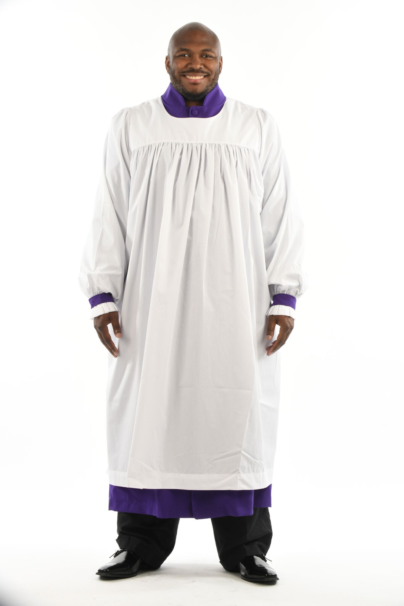 Men's Rochets model showcasing a comfortable white rochet with purple accents, ideal for ecclesiastical attire.
