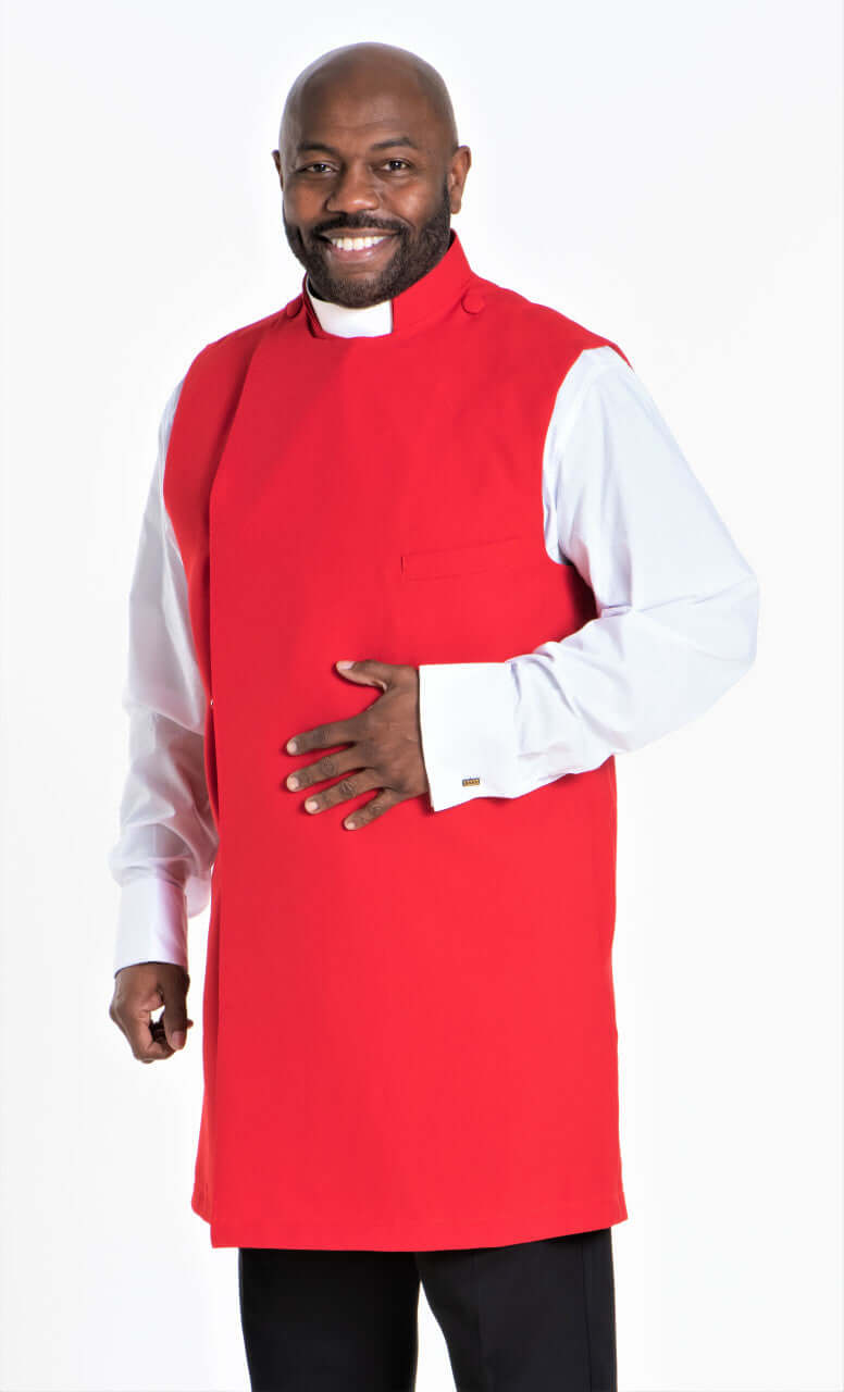 Clergy Apron In Red worn by a smiling man, featuring a full cut fit and snap closure.